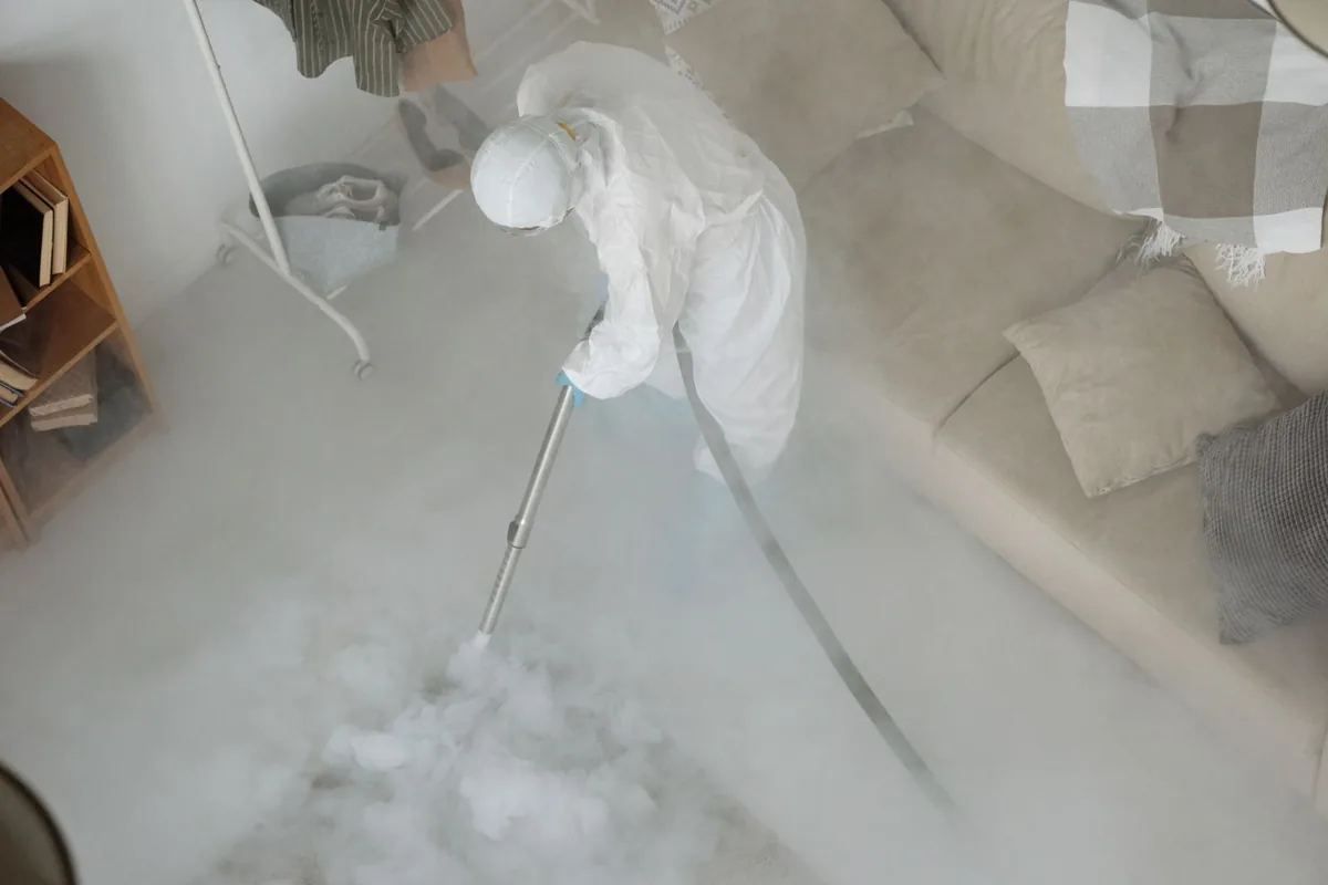 Biohazard cleanup technician in protective equipment, Pine Ridge, FL